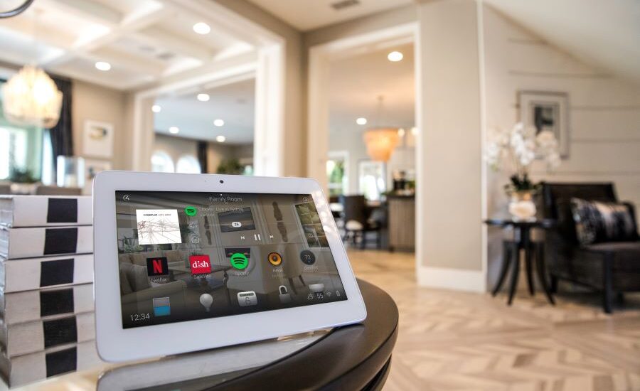 A Control4 touchscreen on a table in a home.