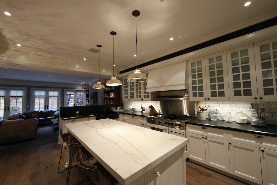 A kitchen is illuminated with soft lights for ambiance.