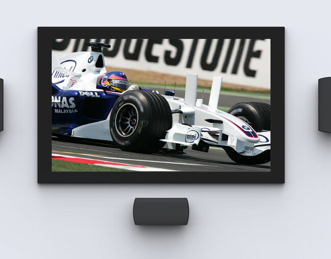 A TV screen featuring a racing car and surround sound system. 